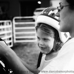 girl getting ready to ride horse